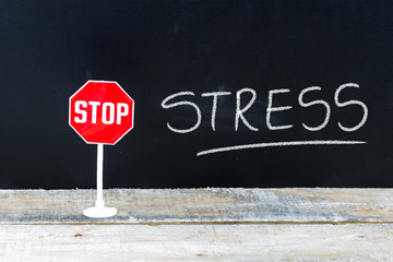 STOP STRESS message written on chalkboard