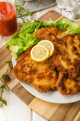 Delicious schnitzel with salad