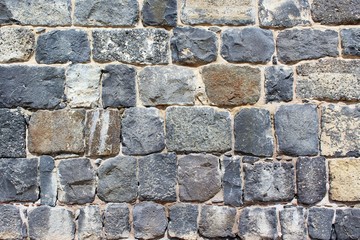 Texture of the stone wall. Dark granite as modern grunge design. 