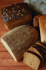 Set of different kind of bread types on wooden table