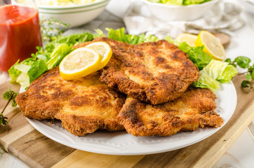 Delicious schnitzel with salad