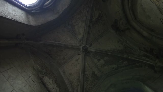 Interior of ancient stone crypt in cemetery