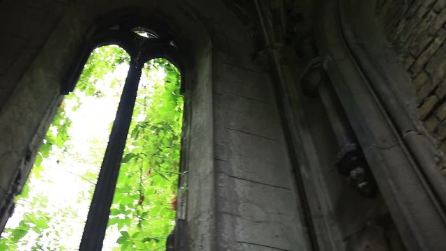 Window opening in ancient stone crypt at graveyard