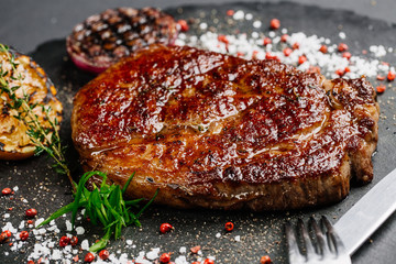 Beef rump steak from marble beef medium rare with grilled lemon