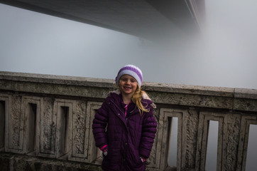 Fototapeta premium child by foggy bridge