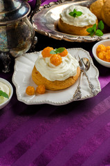 Dessert with cream and berries cloudberries. Place for text.