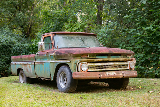 Vintage Pickup Truck In A Grass Field