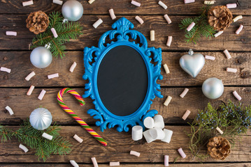 Christmas wooden background with blue frame