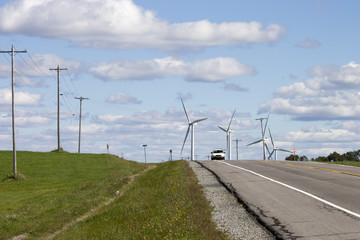 Car Driving Near Windmills 