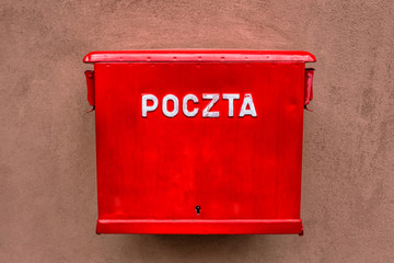 Red mailbox hanging on the wall in Poland © lstudio