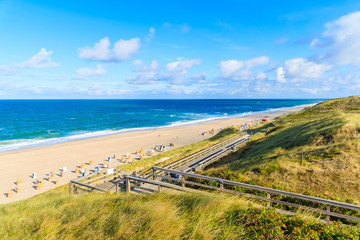 Steps from sand dune to beach in Wenningstedt, Sylt island, Germany