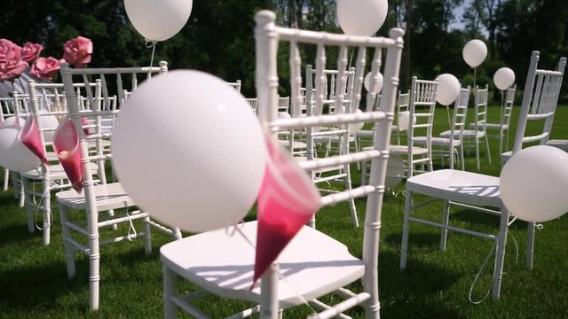Wedding ceremony in the open countryside, summer, warm weather, Chiavari chairs.