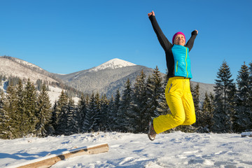 Woman having fun in winter  mountains