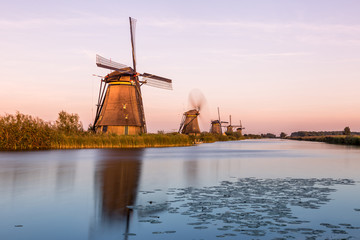 Windmills of Kinderdijk near Rotterdam in Netherlands. Colorful spring scene in the famous...
