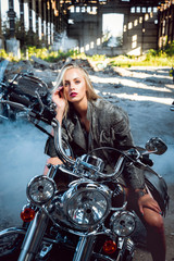 Fototapeta na wymiar Pretty woman on the motorcycle.