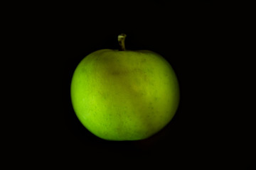 juicy and beautiful apple on a black background large