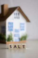 Mortgage concept focused on the letters sale, real estate property with loan money bank concept.