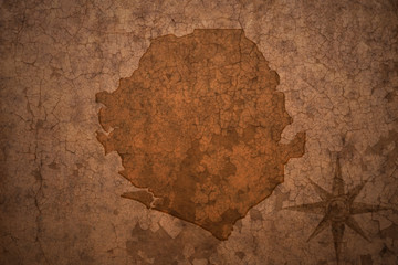 sierra leone map on a old vintage crack paper background