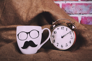 Coffee cup with a black hipster mustache  Vintage Retro Filter.