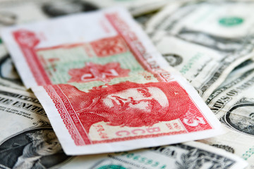 Obraz na płótnie Canvas Three Cuban pesos bill over several dollar bills