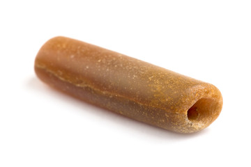 part petrified belemnite on a white background