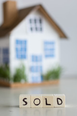 Mortgage concept focused on the letters sold, real estate property with loan money bank concept.