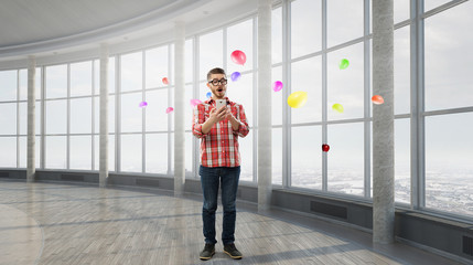 Fototapeta premium Hipster guy use his smartphone . Mixed media