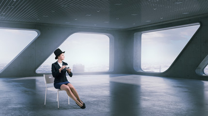 Businesswoman on chair in office . Mixed media