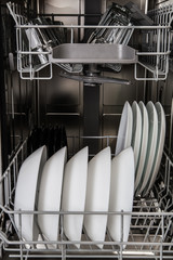 Dishes in a modern dishwasher machine