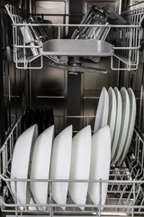 Dishes after washing in dishwasher machine