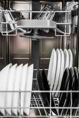 Dishes in a modern dishwasher machine