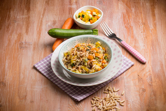 rice with mixed vegetables and pine nuts