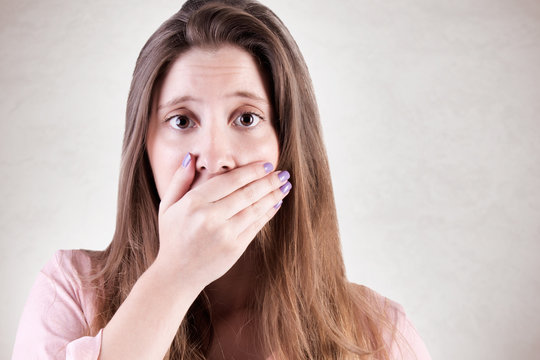 Concerned Woman Covering Mouth