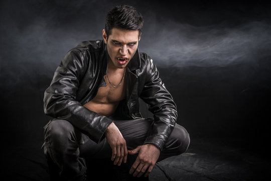 Young Vampire Man in an Open Black Leather Jacket