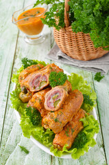 Meat rolls stuffed with bacon and pickled cucumber