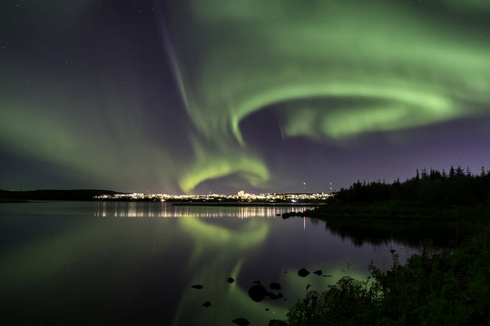 Aurora over Reykjavik city