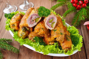 Meat rolls stuffed with bacon and pickled cucumber