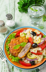 Breaded fried pork cutlet served with pasta salad