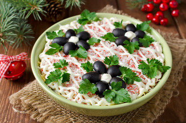 Salad with crab sticks, cheese, egg and prunes