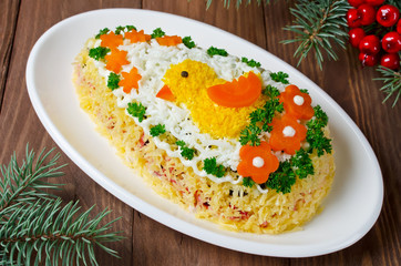 Festive salad Egg decorated with a chick and vegetables
