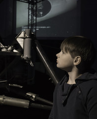 Fototapeta na wymiar people and space. future technologies. Boy in Museum