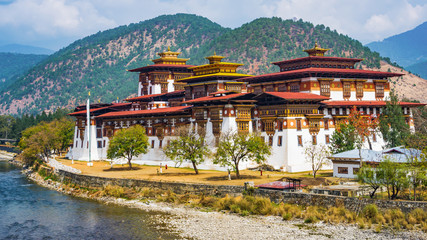 The Punakha Dzong Monastery in Bhutan Asia one of the largest monestary in Asiawith the landscape and mountains background, Punakha,Bhutan - obrazy, fototapety, plakaty