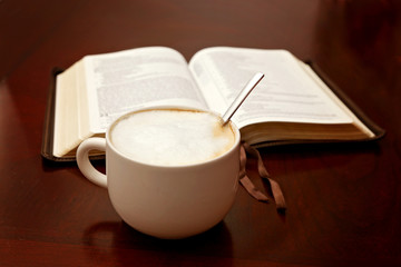 Holy Bible Open on a Wooden Table