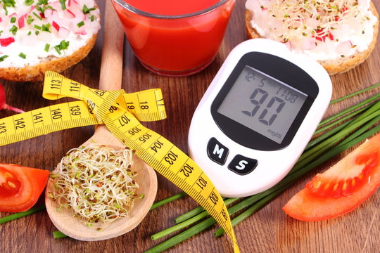 Glucometer, freshly sandwich, tomato juice and centimeter, diabetes, healthy nutrition