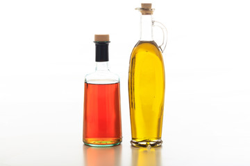 Olive oil and vinegar on white background