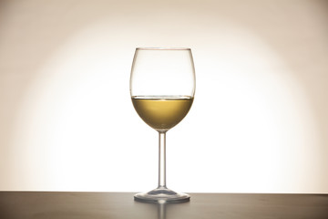 Glass of wine on gradient background