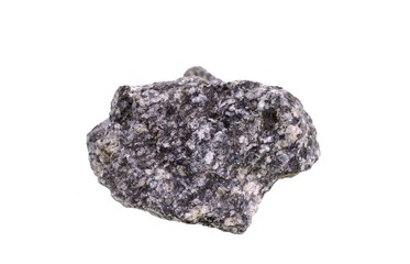 Granite stones in front of a single stone composition, isolated over the white background