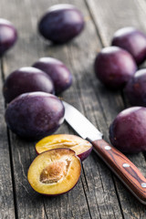 Fototapeta premium Halved ripe plums.