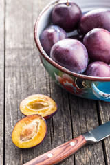 Halved ripe plums.