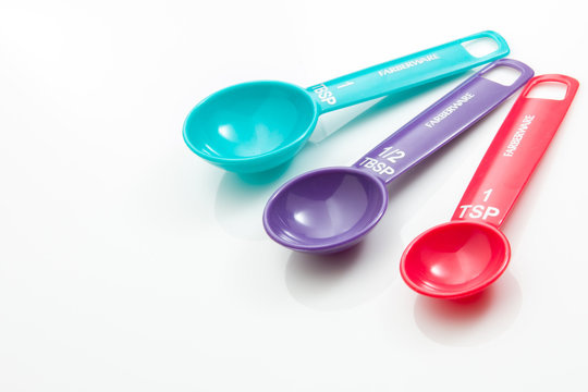Colorful Measuring spoons on a white background.